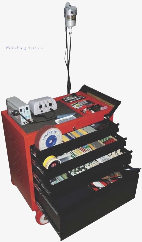 A red, multi-level polishing station with tools and accessories neatly organized for professional metal surface finishing