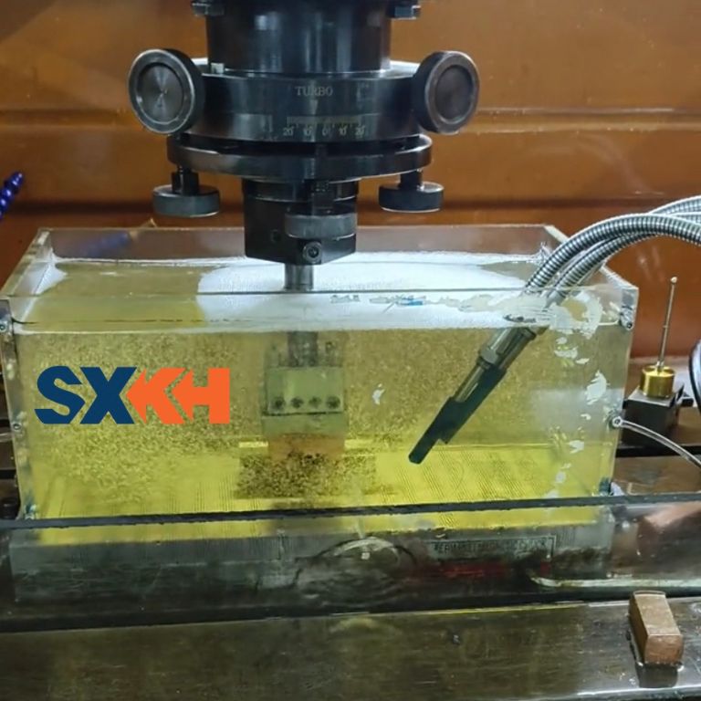 A Sinker EDM machine for creating complex cavities and shapes in hard metals, commonly used in die and mold making.