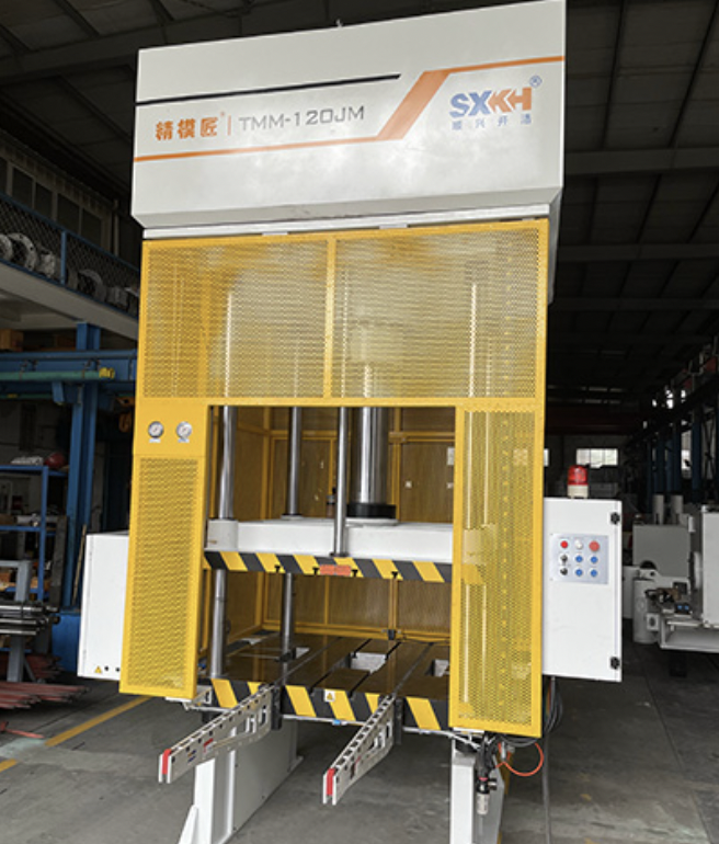 An industrial trimming press for trimming excess material and flash from molded plastic and metal parts.