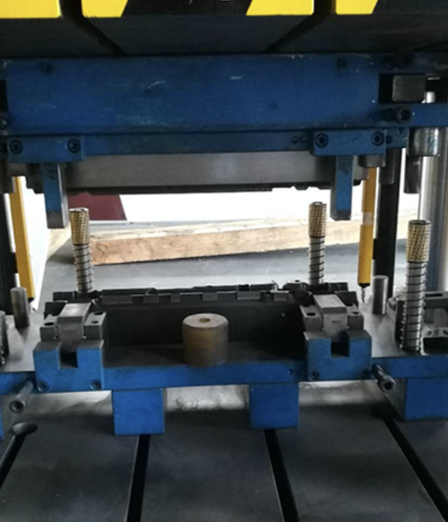 An industrial trimming press for trimming excess material and flash from molded plastic and metal parts.