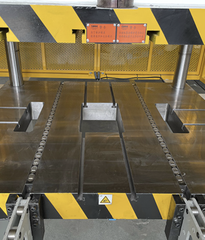 An industrial trimming press for trimming excess material and flash from molded plastic and metal parts.