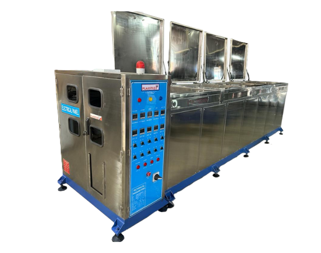 An industrial ultrasonic cleaner with a stainless steel tank, used for deep cleaning small parts and tools.